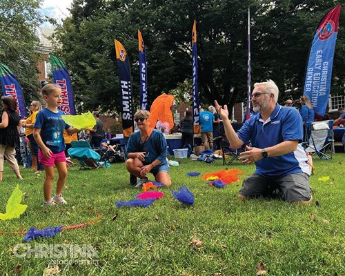 Superintendent of Christina School District at play with students at Newark Community Day